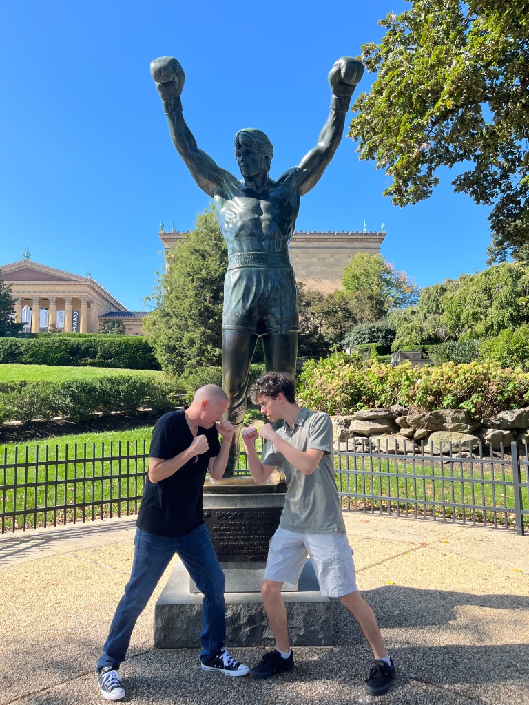 Posing with the Rocky statue in Philly