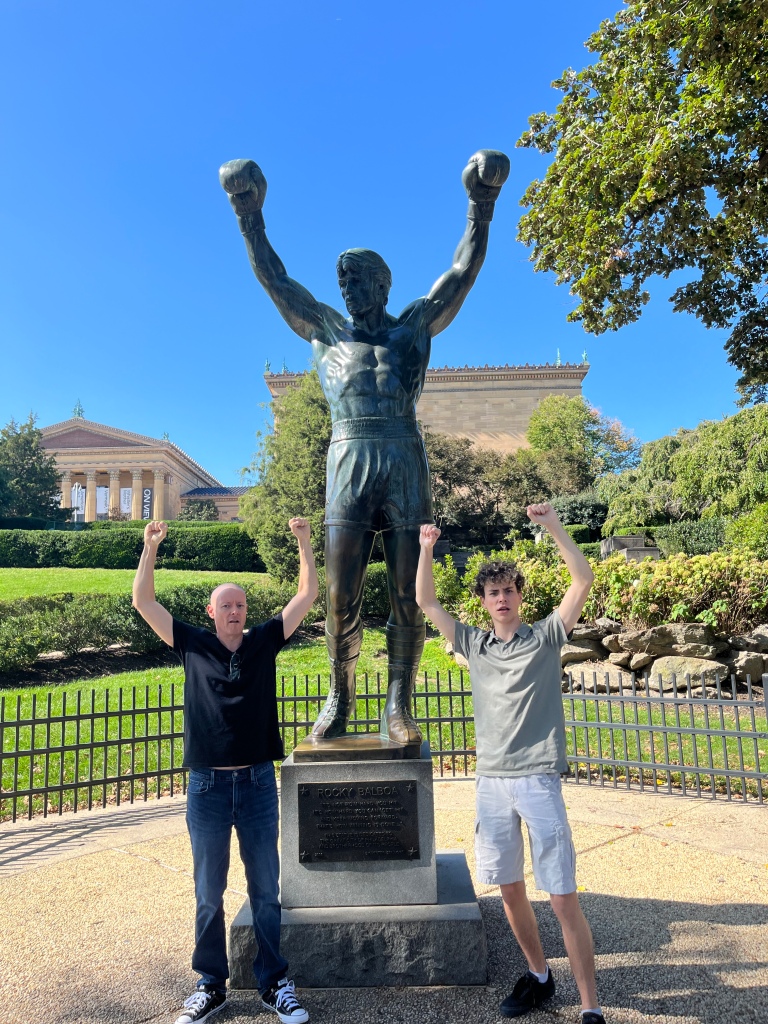 Posing with the Rocky statue in Philly